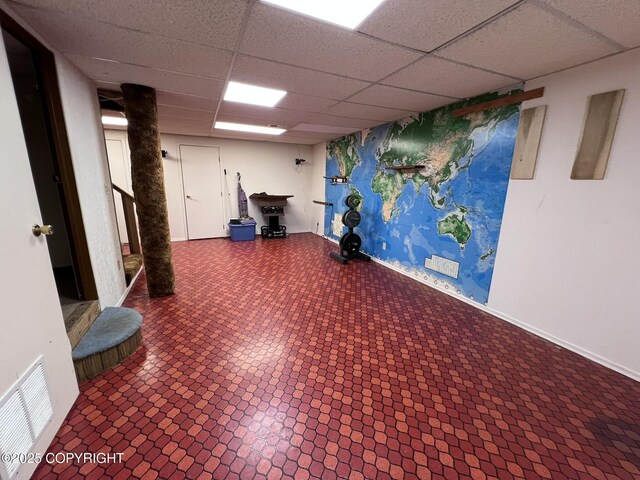 7700 Dover Ave, Anchorage, AK 99504 - finished basement featuring a paneled ceiling and baseboards