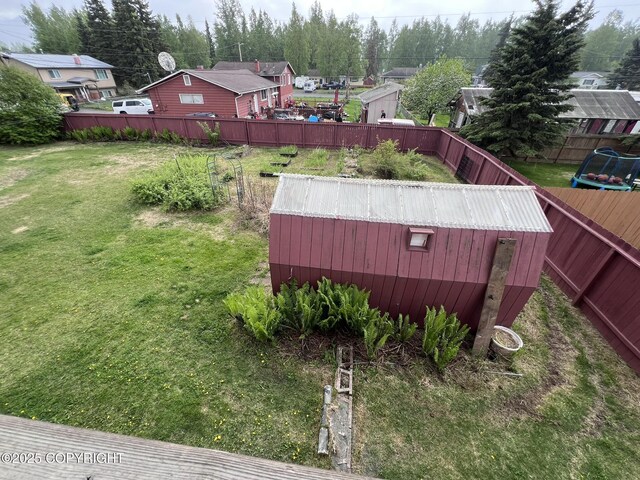 7700 Dover Ave, Anchorage, AK 99504 - view of yard with a wooden deck