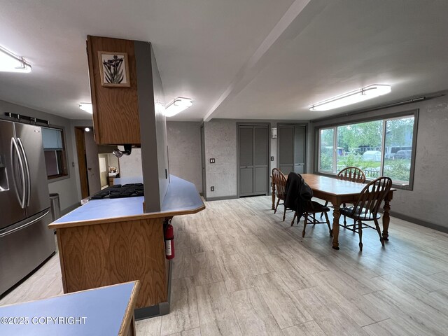 7700 Dover Ave, Anchorage, AK 99504 - dining space featuring baseboards and light wood-style floors