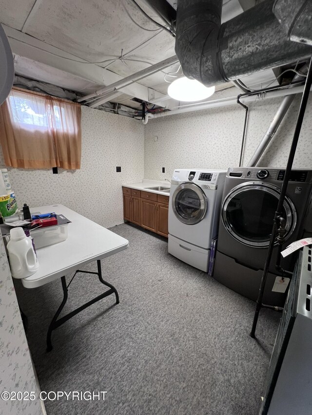 7700 Dover Ave, Anchorage, AK 99504 - laundry room featuring cabinet space, independent washer and dryer, wallpapered walls, and light colored carpet