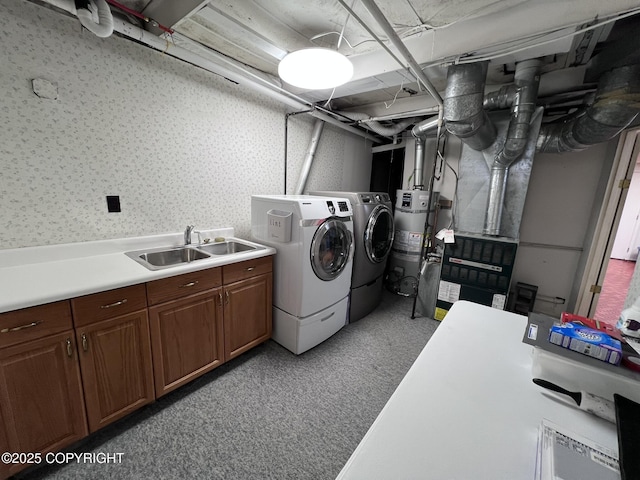 7700 Dover Ave, Anchorage, AK 99504 - laundry room with washer and dryer, strapped water heater, cabinet space, wallpapered walls, and light carpet