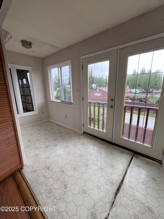 7700 Dover Ave, Anchorage, AK 99504 - unfurnished sunroom featuring french doors