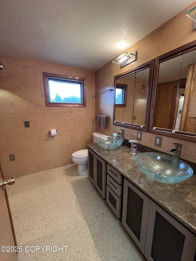 7700 Dover Ave, Anchorage, AK 99504 - bathroom featuring double vanity and toilet