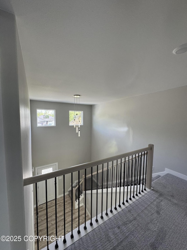 3120 W Wintergreen Dr, Wasilla, AK 99623 - staircase featuring a chandelier and carpet flooring