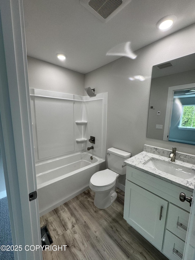 3120 W Wintergreen Dr, Wasilla, AK 99623 - full bath with vanity, wood finished floors, and bathing tub / shower combination