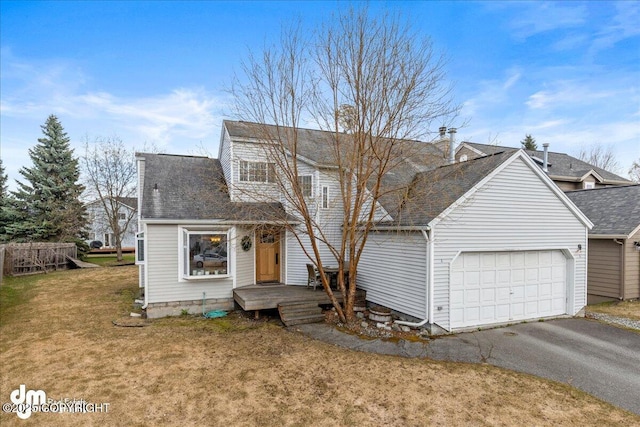 10613 Washington Cir, Anchorage, AK 99515 - view of front of home with an attached garage, driveway, a front yard, a wooden deck, and a shingled roof
