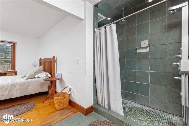 10613 Washington Cir, Anchorage, AK 99515 - bathroom featuring a shower stall, baseboards, and tile patterned flooring