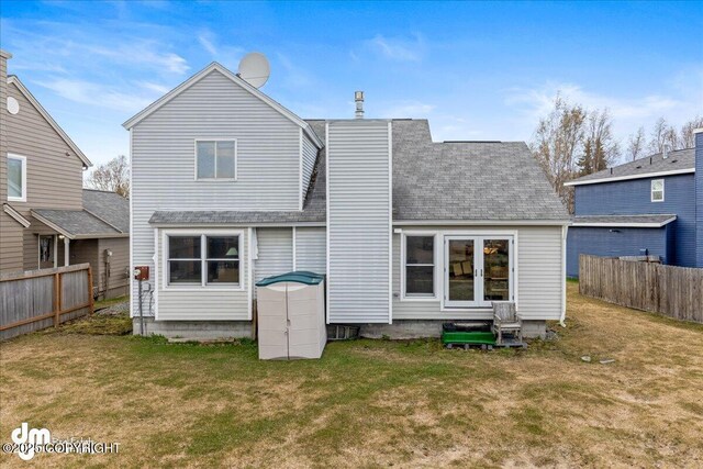 10613 Washington Cir, Anchorage, AK 99515 - back of house featuring roof with shingles and a chimney