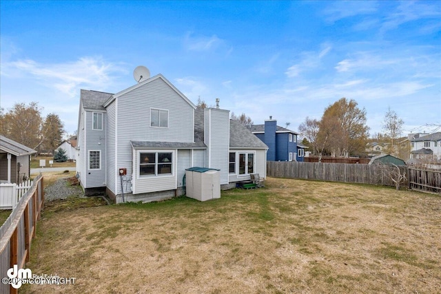 10613 Washington Cir, Anchorage, AK 99515 - back of property with a chimney and roof with shingles