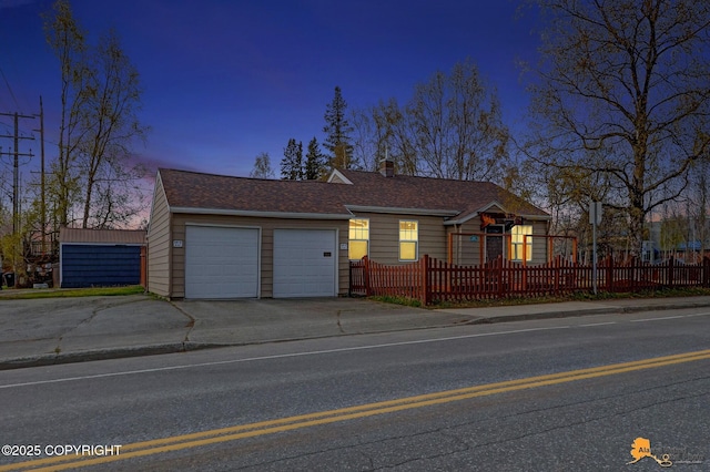 1008 Cordova St, Anchorage, AK 99501 - ranch-style home with a garage, concrete driveway, and a chimney