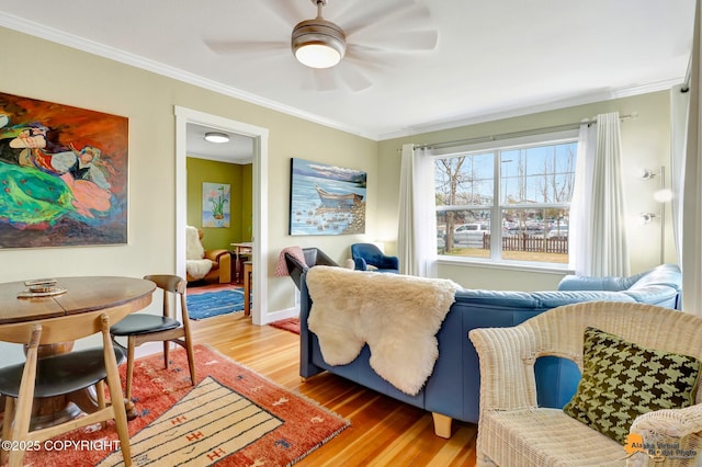 1008 Cordova St, Anchorage, AK 99501 - living room with light wood-style flooring, ornamental molding, ceiling fan, and baseboards