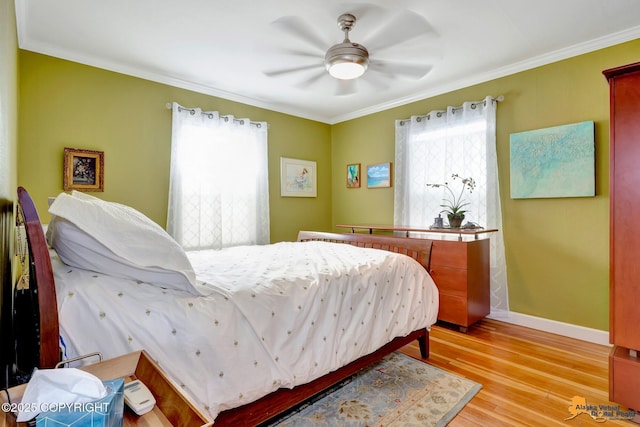 1008 Cordova St, Anchorage, AK 99501 - bedroom with baseboards, crown molding, light wood-type flooring, and ceiling fan