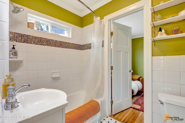 1008 Cordova St, Anchorage, AK 99501 - full bathroom featuring a sink, crown molding, tile walls, shower / tub combo, and toilet