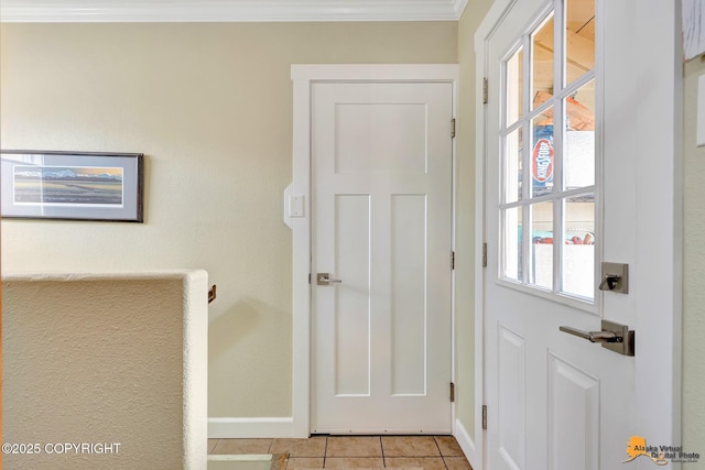 1008 Cordova St, Anchorage, AK 99501 - doorway to outside featuring light tile patterned floors, ornamental molding, and baseboards