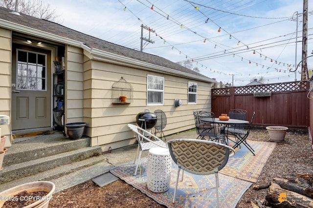 1008 Cordova St, Anchorage, AK 99501 - view of patio with fence, outdoor dining area, and area for grilling