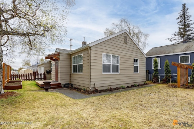 1008 Cordova St, Anchorage, AK 99501 - rear view of property with a chimney and a wooden deck