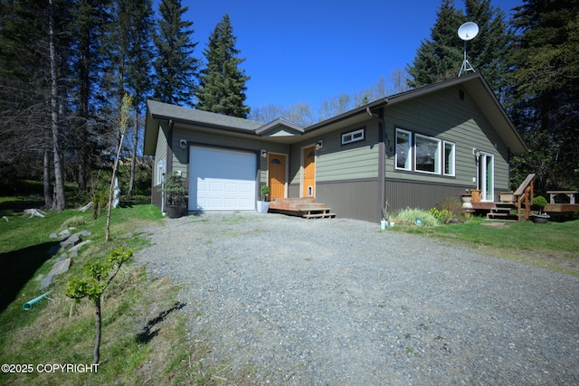 876 Lupine Ct, Homer, AK 99603 - ranch-style house featuring gravel driveway and a garage