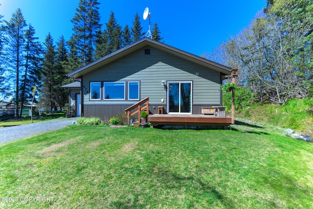 876 Lupine Ct, Homer, AK 99603 - back of house featuring a wooden deck, a yard, and driveway