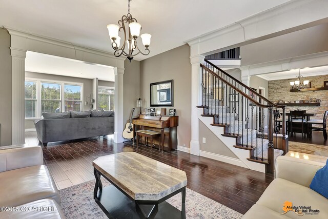 10588 E Nighthawk Cir, Palmer, AK 99645 - living room with a chandelier, decorative columns, wood finished floors, baseboards, and stairway