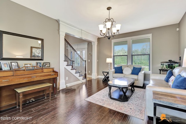10588 E Nighthawk Cir, Palmer, AK 99645 - living room featuring ornate columns, wood finished floors, a chandelier, stairs, and baseboards