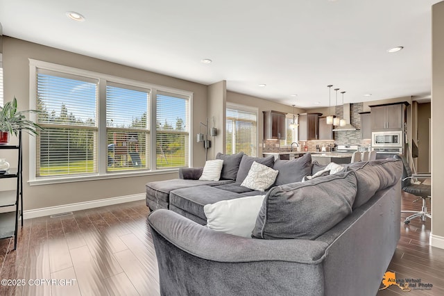 10588 E Nighthawk Cir, Palmer, AK 99645 - living area with baseboards, recessed lighting, and dark wood finished floors