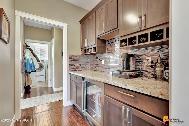 10588 E Nighthawk Cir, Palmer, AK 99645 - kitchen with wine cooler, washing machine and clothes dryer, backsplash, and open shelves