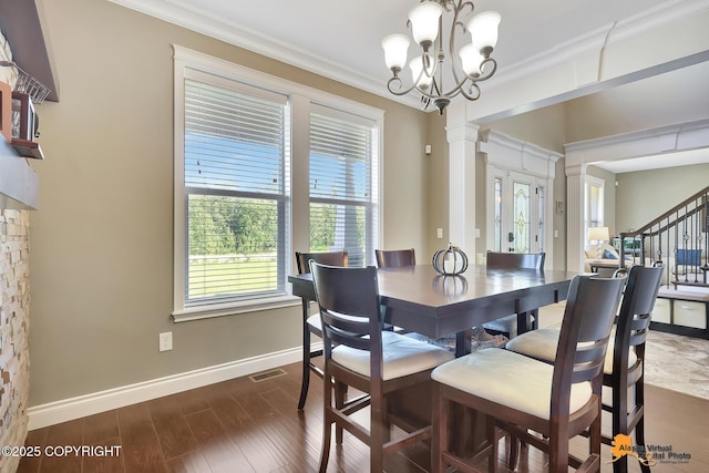 10588 E Nighthawk Cir, Palmer, AK 99645 - dining room featuring crown molding, baseboards, dark wood-style floors, a chandelier, and stairs