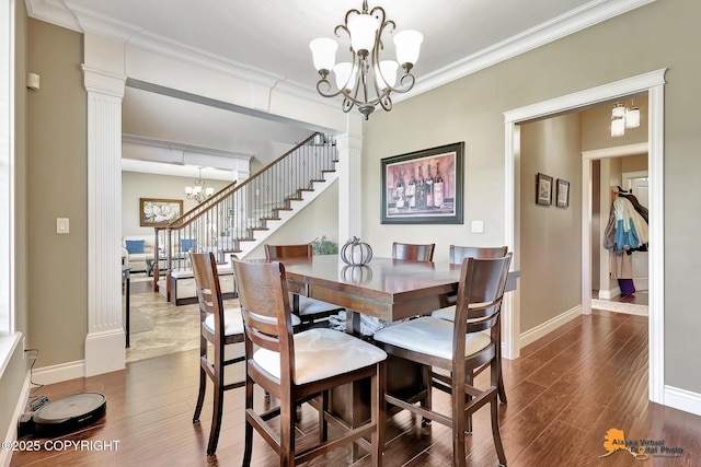 10588 E Nighthawk Cir, Palmer, AK 99645 - dining space with a chandelier, dark wood-style floors, baseboards, crown molding, and stairway
