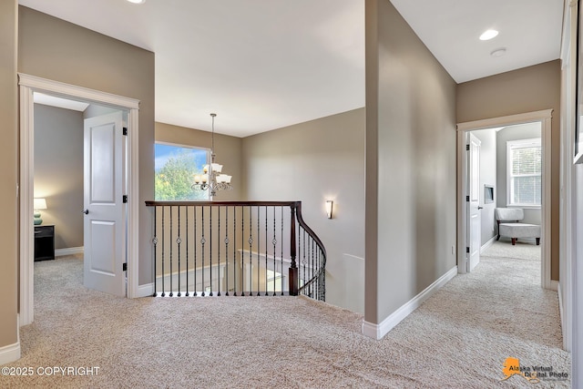10588 E Nighthawk Cir, Palmer, AK 99645 - corridor with carpet, a chandelier, and healthy amount of natural light