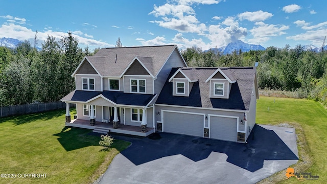 10588 E Nighthawk Cir, Palmer, AK 99645 - view of front of property with covered porch, asphalt driveway, an attached garage, and a mountain view