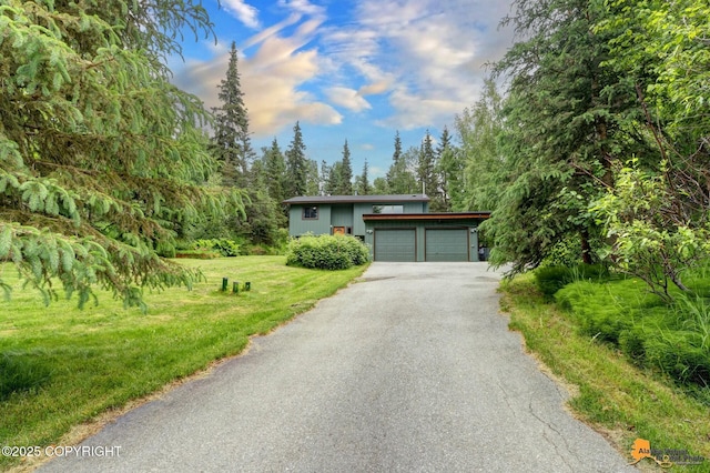 11721 Wranglers Way, Anchorage, AK 99516 - view of front of home with driveway, a garage, and a front lawn