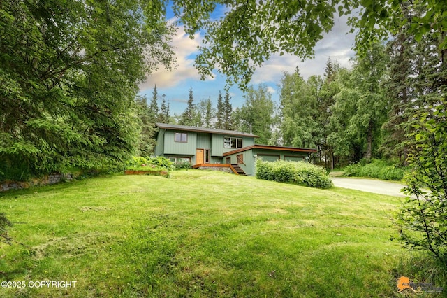 11721 Wranglers Way, Anchorage, AK 99516 - view of front of property with a front yard and driveway