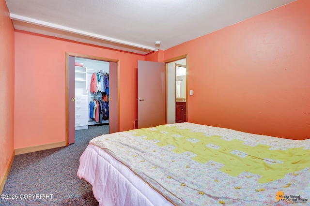 11721 Wranglers Way, Anchorage, AK 99516 - bedroom with carpet floors, a walk in closet, and a closet