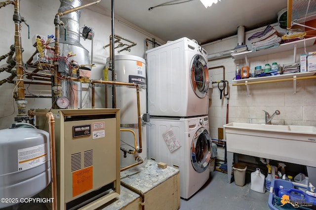 11721 Wranglers Way, Anchorage, AK 99516 - laundry area with stacked washing machine and dryer and water heater