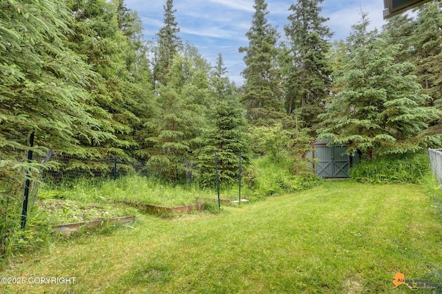 11721 Wranglers Way, Anchorage, AK 99516 - view of yard with a storage unit