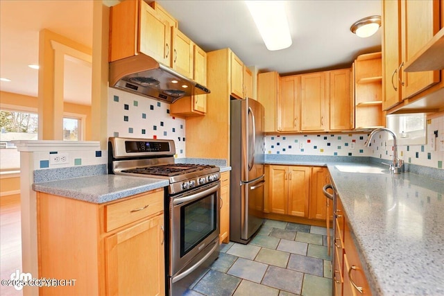 kitchen featuring stainless steel appliances, a sink, under cabinet range hood, open shelves, and tasteful backsplash