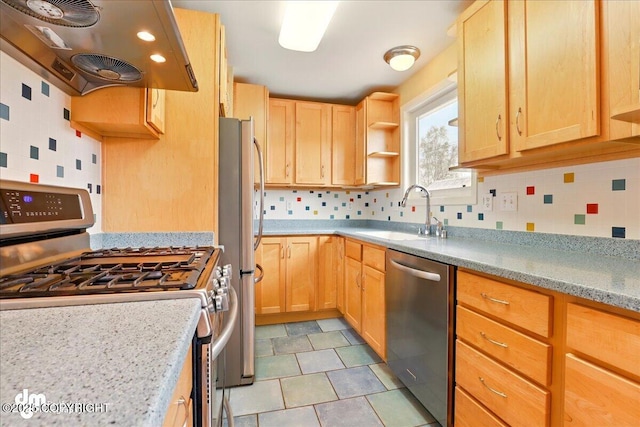 kitchen with appliances with stainless steel finishes, wall chimney exhaust hood, light brown cabinets, open shelves, and a sink