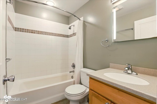 full bathroom featuring shower / tub combo with curtain, toilet, and vanity