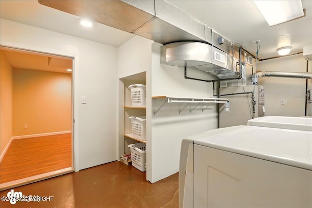 laundry area with washer and dryer and recessed lighting