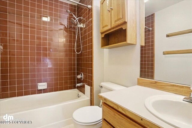 full bathroom with toilet, vanity, and  shower combination