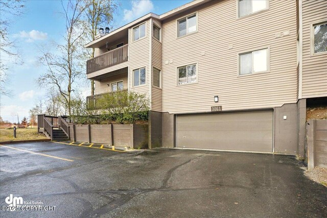 view of building exterior with an attached garage