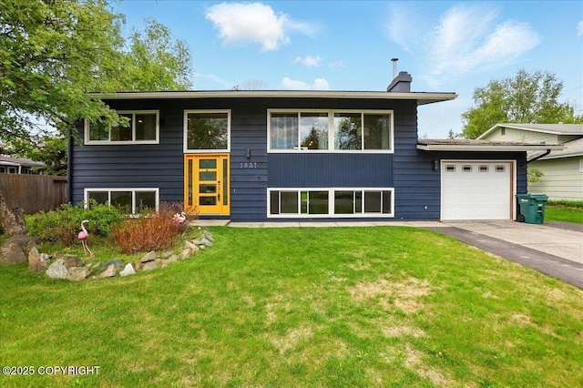 1831 S Salem Dr, Anchorage, AK 99508 - view of front of house with driveway, a garage, and a chimney