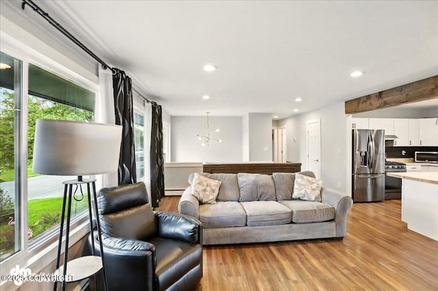 1831 S Salem Dr, Anchorage, AK 99508 - living area with light wood finished floors, recessed lighting, and a chandelier
