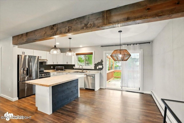 1831 S Salem Dr, Anchorage, AK 99508 - kitchen with appliances with stainless steel finishes, a sink, beam ceiling, wood counters, and backsplash