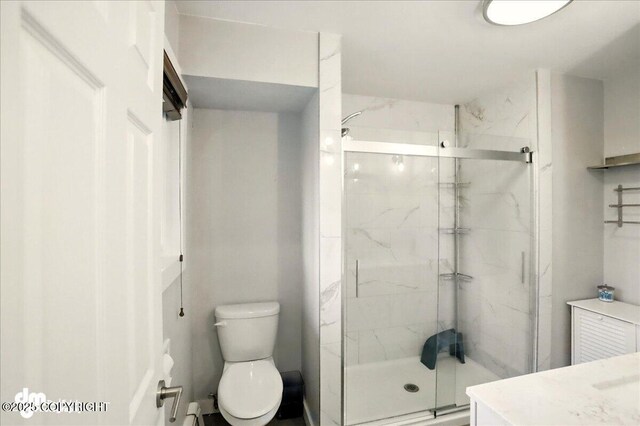 1831 S Salem Dr, Anchorage, AK 99508 - bathroom featuring toilet, a marble finish shower, and vanity