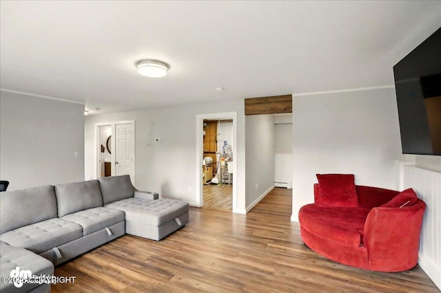 1831 S Salem Dr, Anchorage, AK 99508 - living area featuring wood finished floors, baseboard heating, and baseboards