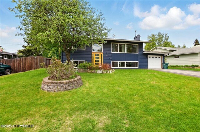 1831 S Salem Dr, Anchorage, AK 99508 - raised ranch featuring a chimney, driveway, and an attached garage