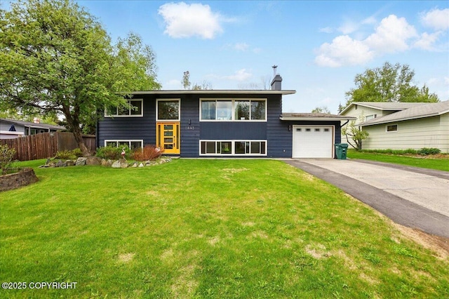1831 S Salem Dr, Anchorage, AK 99508 - view of front facade with driveway, a garage, and a chimney
