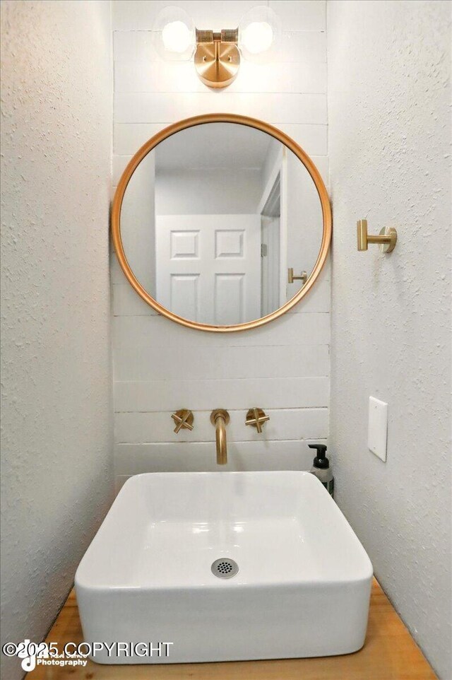 1831 S Salem Dr, Anchorage, AK 99508 - bathroom featuring a sink and wood finished floors