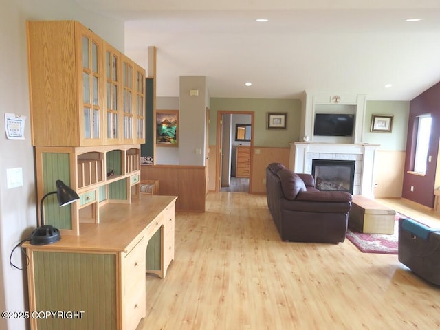 2340 E End Rd, Homer, AK 99603 - living area featuring a wainscoted wall, a fireplace, light wood-style flooring, and recessed lighting